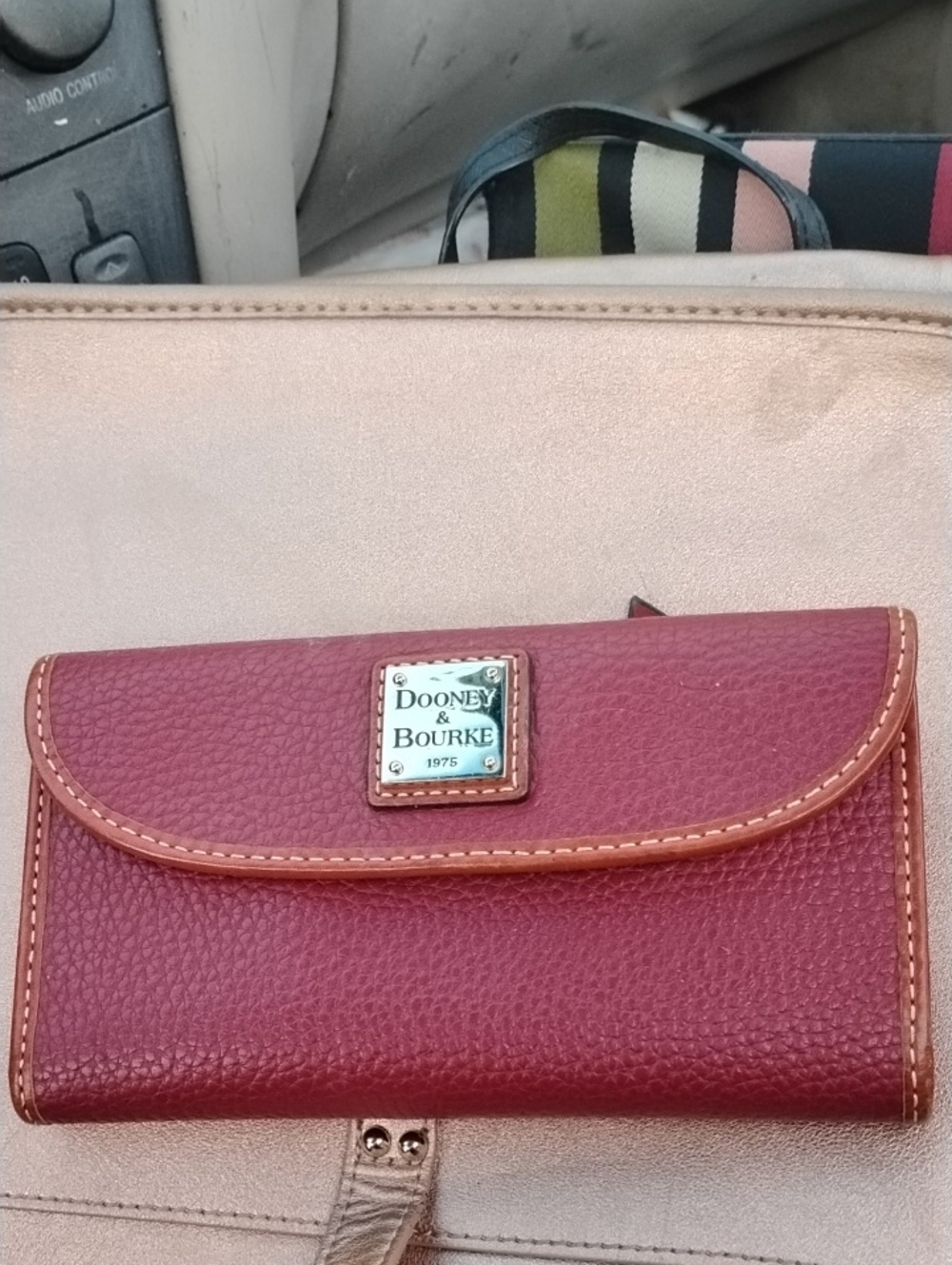 Dooney & Bourke Pinkish Red Pebbled Leather Flap Wallet